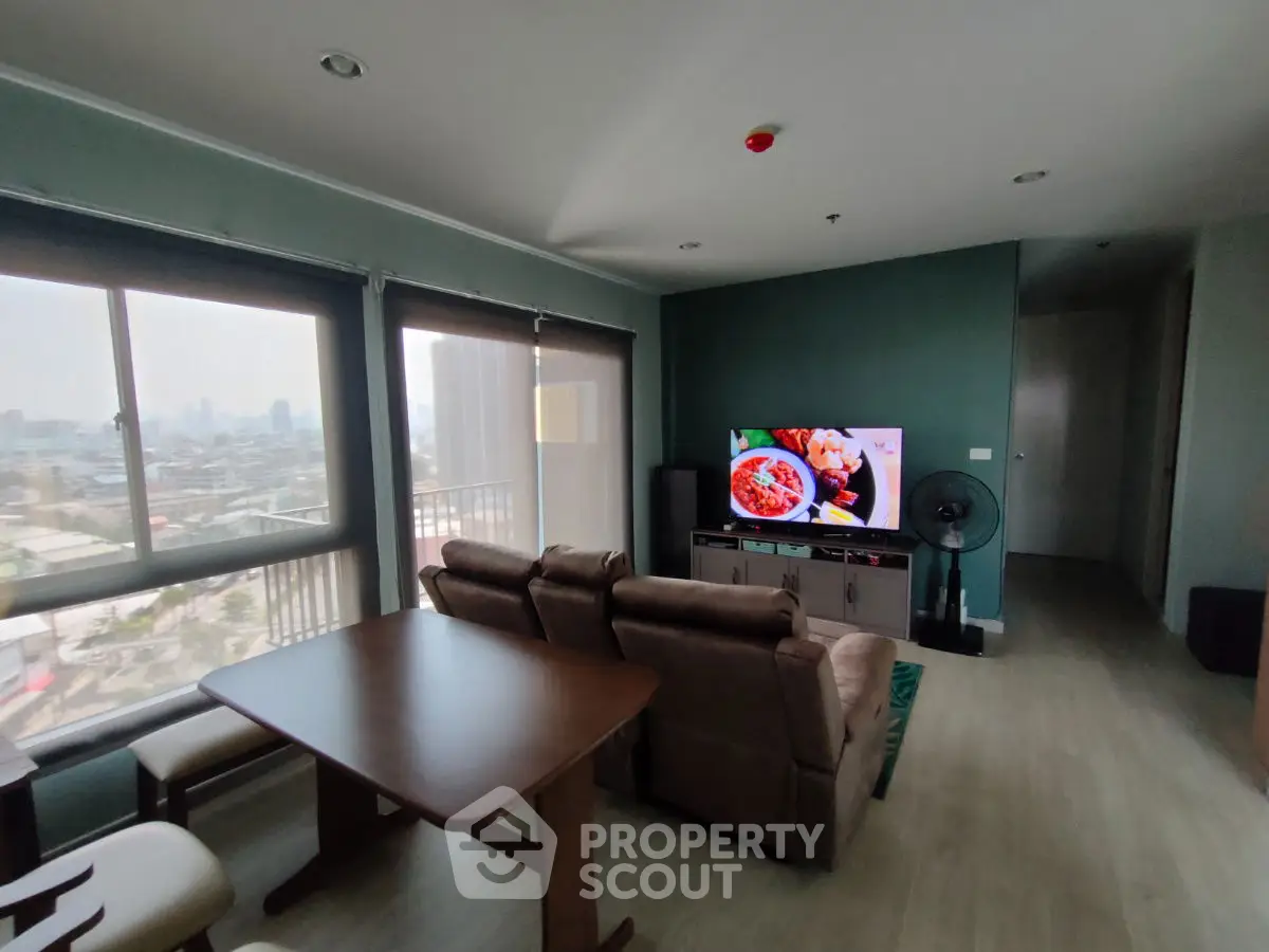 Spacious living room with city view and modern furniture