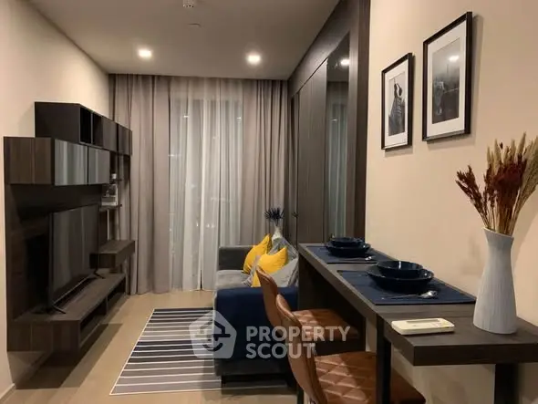 Modern living room with stylish decor, cozy seating, and elegant dining area in a contemporary apartment.