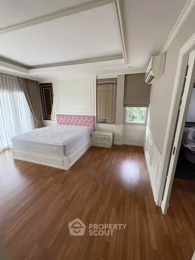 Spacious bedroom with elegant design and natural light