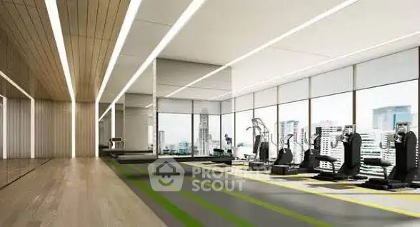 Spacious modern gym with city view and state-of-the-art equipment in luxury building.