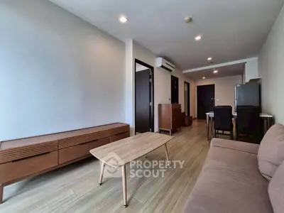 Modern living room with wooden furniture and neutral tones