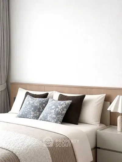 Elegant bedroom with modern decor and cozy bedding in a stylish apartment.