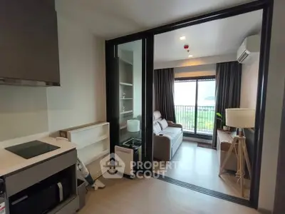 Modern apartment interior with sliding glass doors and cozy living area