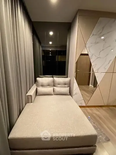 Luxurious modern living room with elegant chaise lounge and stylish decor