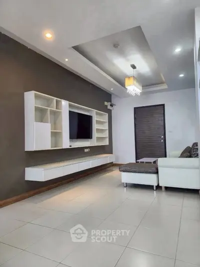 Modern living room with sleek furniture and stylish lighting