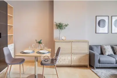 Modern living room with stylish furniture and dining area, perfect for urban living.