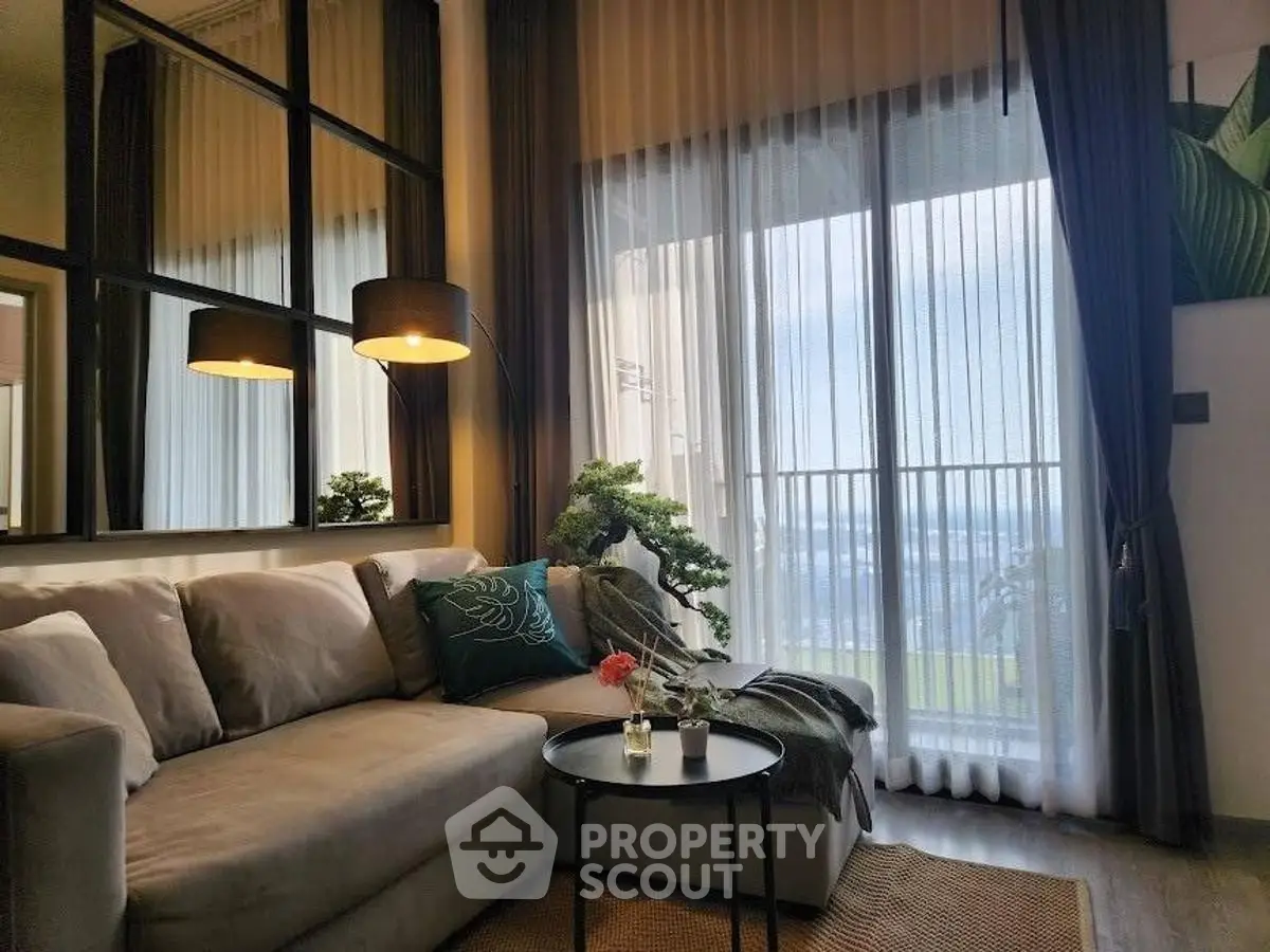 Elegant living room with cozy sofa and stunning balcony view