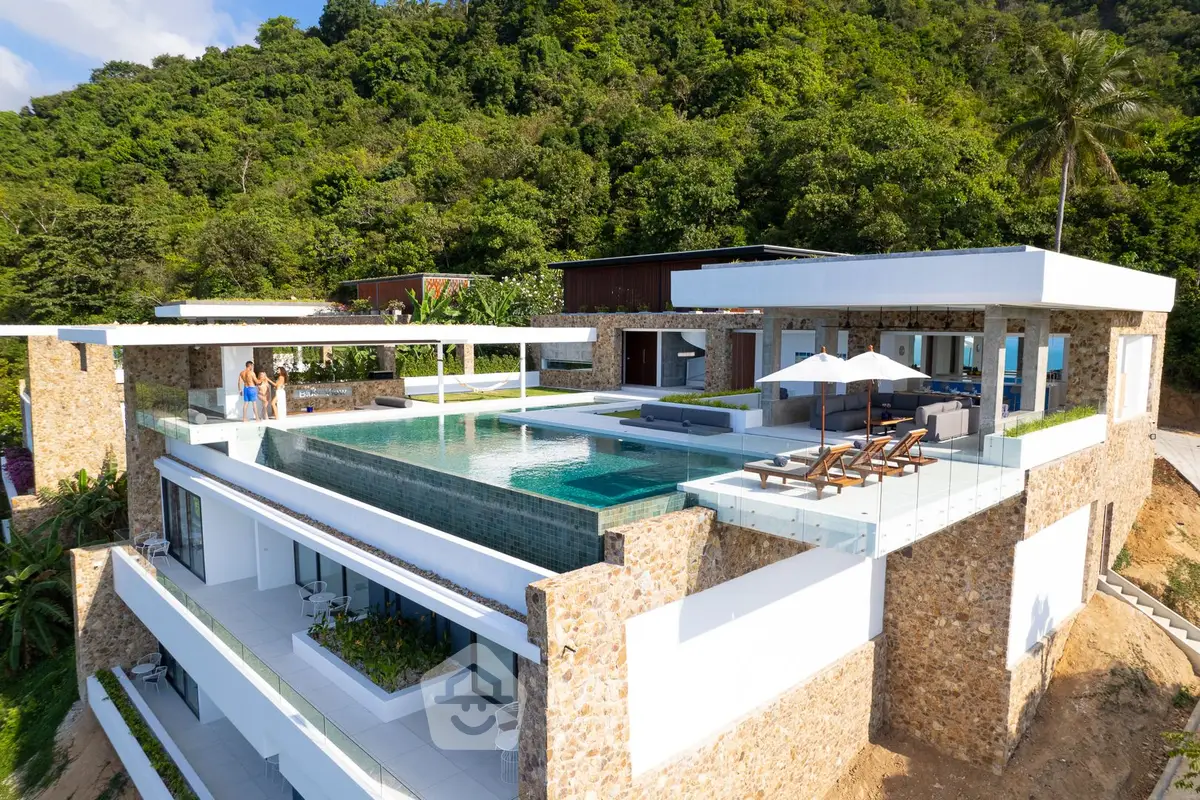 Luxurious modern villa with infinity pool and stunning hillside view, perfect for serene living.