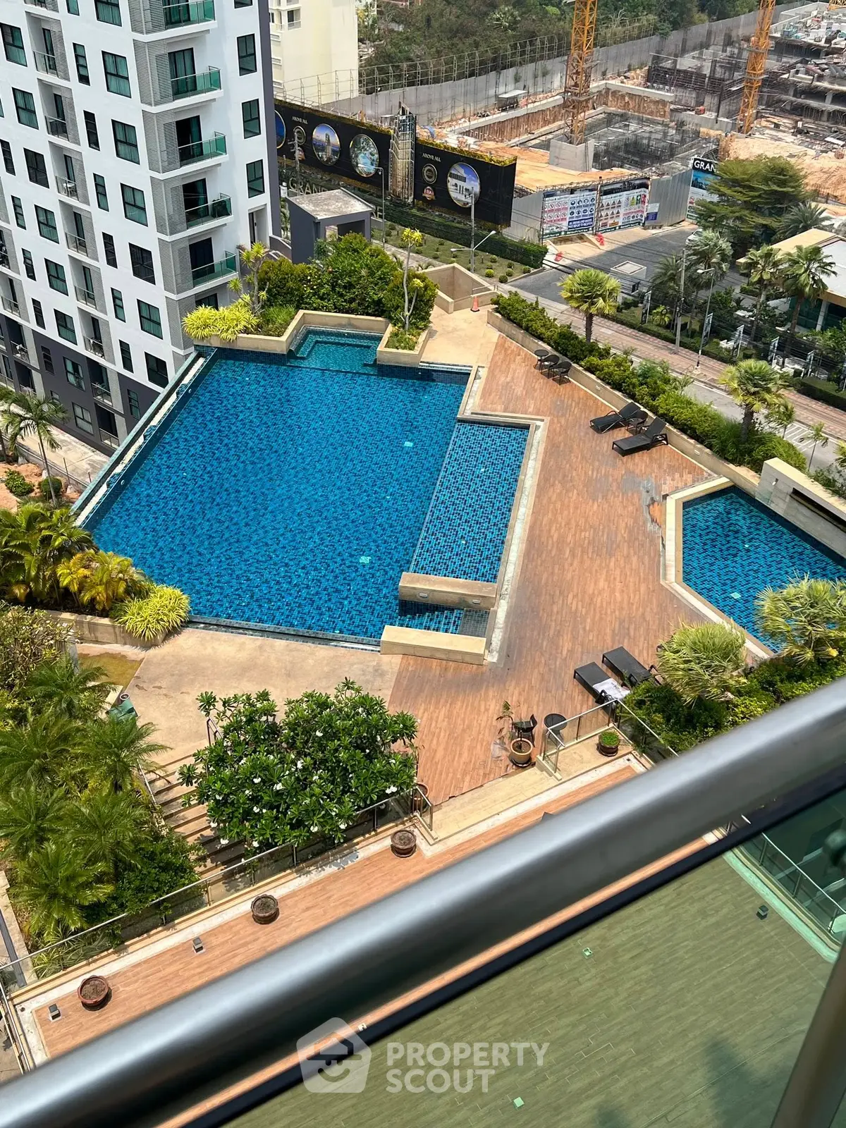 Luxurious high-rise apartment with stunning pool view and modern amenities.