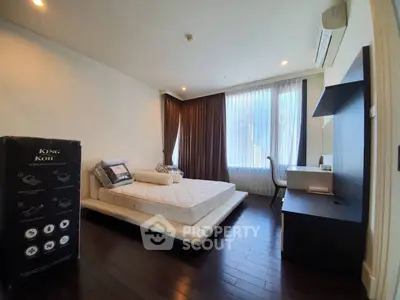Luxurious bedroom with elegant furnishings and natural light