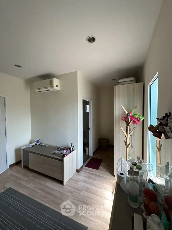 Cozy interior space with wooden flooring and modern furniture, perfect for a stylish home.