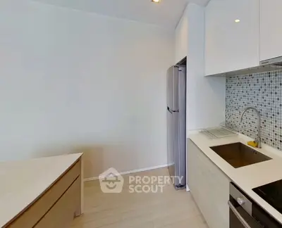 Modern kitchen with sleek cabinetry and stainless steel appliances