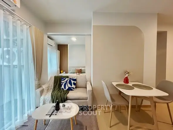 Modern open-plan living and dining area with stylish decor and natural light.