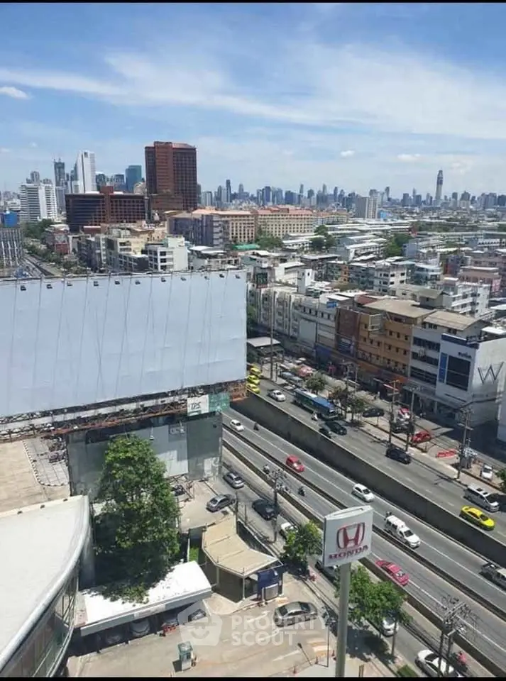 Stunning cityscape view from high-rise building showcasing vibrant urban skyline and bustling streets.