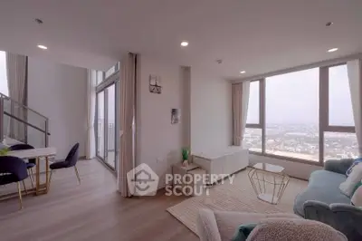 Spacious modern living room with panoramic city views and elegant decor