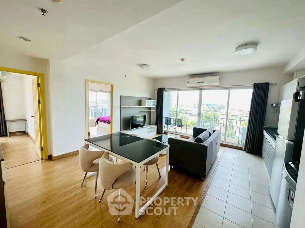 Spacious modern living room with open layout and balcony view