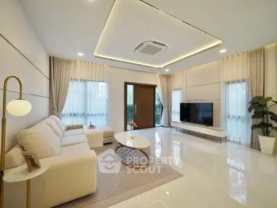 Luxurious modern living room with elegant decor and large TV