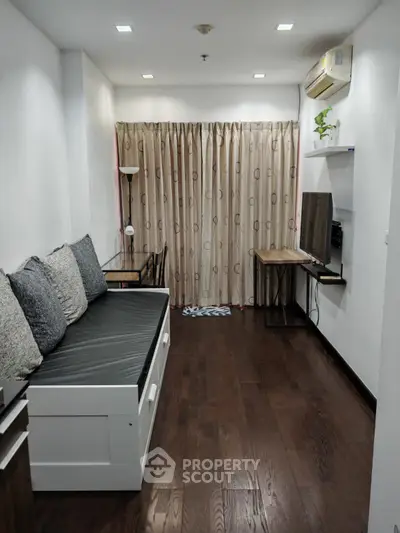 Cozy living room with wooden flooring and modern decor