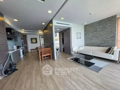 Spacious modern living room with open kitchen and stylish decor