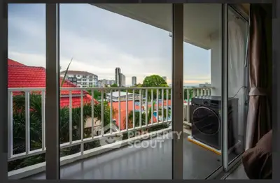 Charming balcony with city view and modern washing machine