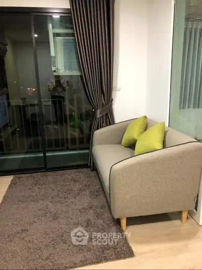 Cozy living room with modern sofa and balcony view