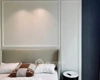 Modern bedroom with stylish decor and cozy bedding