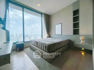 Luxurious bedroom with stunning city view and modern furnishings