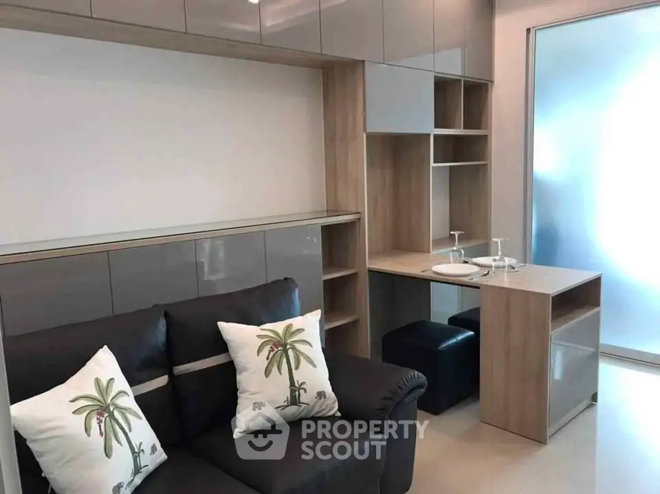 Modern living room with sleek cabinetry and cozy seating, perfect for urban living.