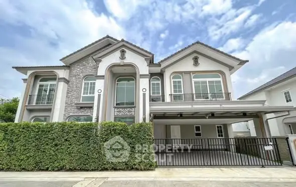 Stunning two-story modern house with elegant facade and spacious driveway.