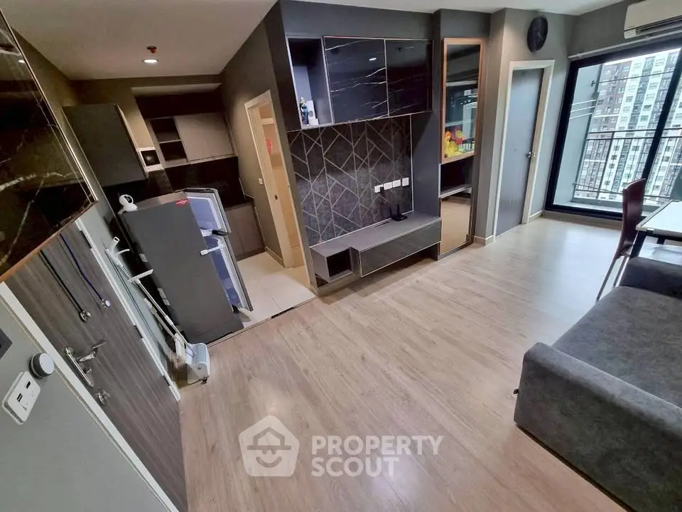 Modern apartment interior with open layout and balcony view