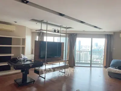 Spacious living room with city view and modern decor