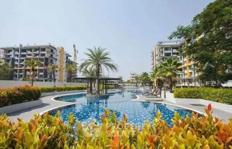Luxurious apartment complex with stunning pool and lush landscaping