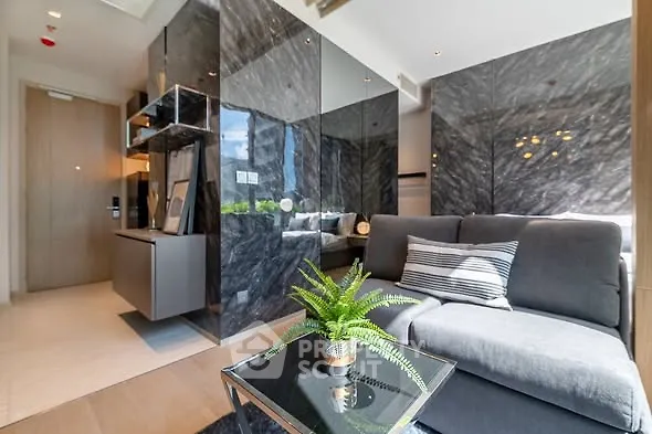 Luxurious modern living room with sleek marble walls and cozy sofa