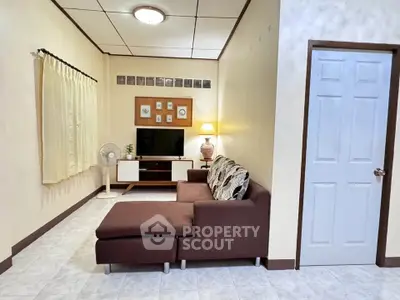 Cozy living room with brown sectional sofa and modern decor