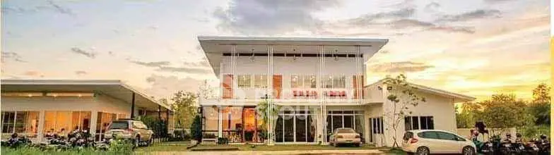 Stunning modern house with large windows and beautiful sunset view, perfect for family living.