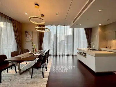 Luxurious dining and kitchen area with elegant lighting and city view