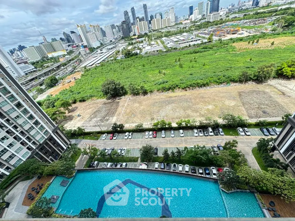 Stunning aerial view of urban landscape with pool and city skyline