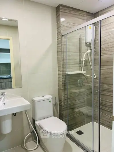 Modern bathroom with glass shower and sleek fixtures