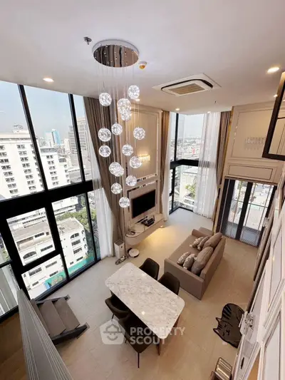 Luxurious high-ceiling living room with modern decor and stunning city views