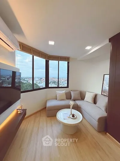 Modern living room with panoramic city view and stylish decor