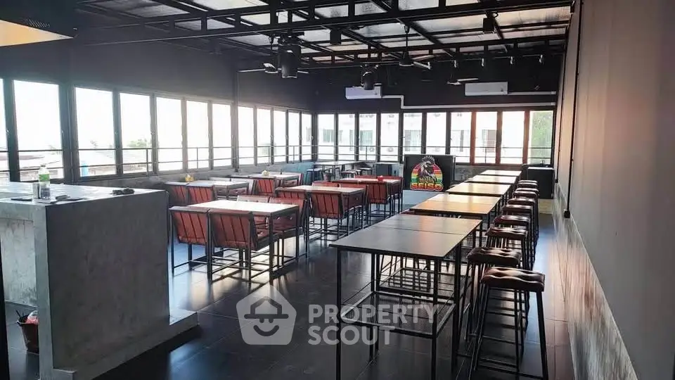 Spacious modern rooftop with stylish seating and panoramic views, perfect for gatherings and events.