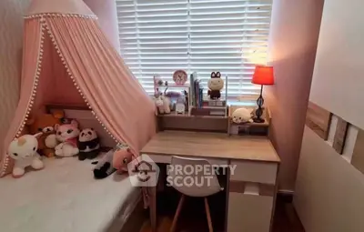 Charming children's bedroom with cozy bed and study desk, perfect for a playful and productive environment.