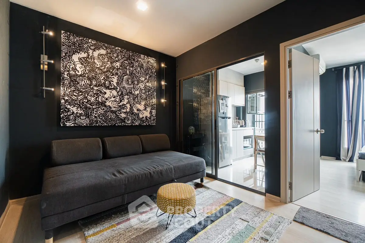Modern living room with stylish decor and open view to kitchen area