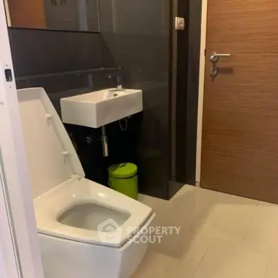 Modern bathroom with sleek design and compact sink
