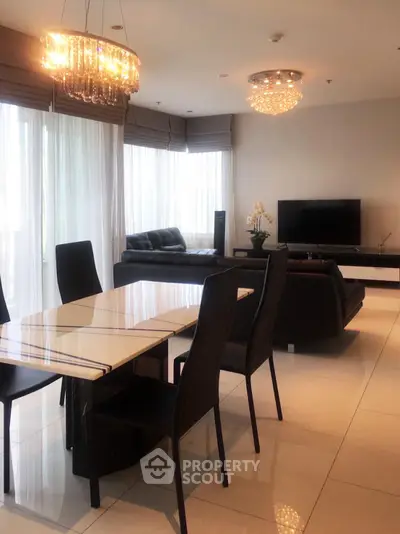 Luxurious modern living room with elegant dining area and stylish chandeliers