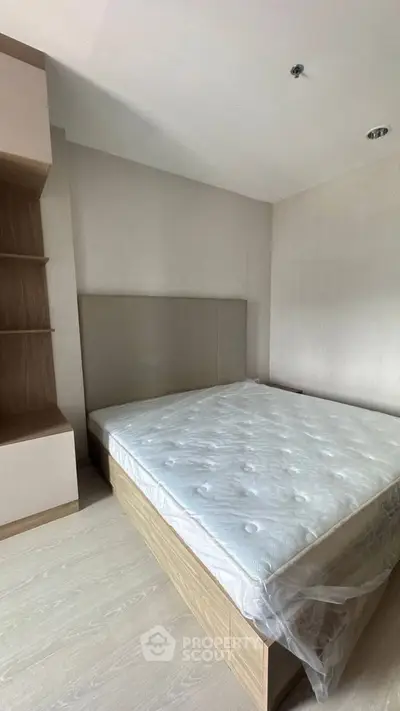 Spacious modern bedroom with new mattress and built-in storage