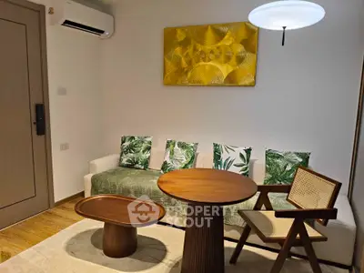 Stylish living room with modern furniture and vibrant decor in a cozy apartment.