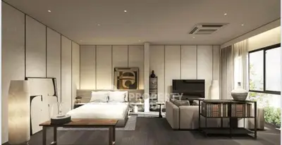 Luxurious modern bedroom with stylish decor and large windows offering natural light.