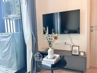 Modern living room with wall-mounted TV and stylish decor