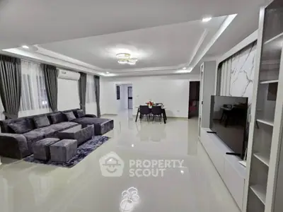 Spacious modern living room with elegant decor and dining area